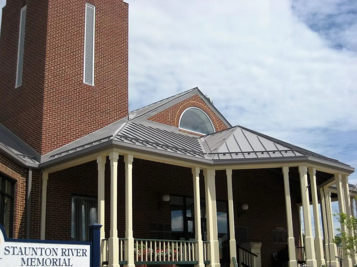 Skilled roofing craftsmen working on a residential roof in Englesville